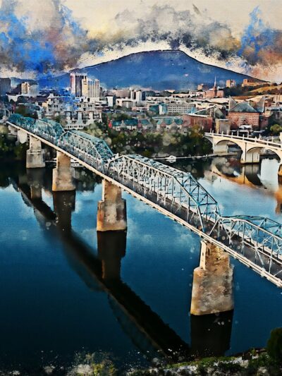 The Chattanooga watercolor skyline canvas captures a vibrant cityscape with bridges over a river, set against mountains and dynamic clouds reflecting on the water. Ideal for digital download or canvas wall art, it brings Chattanoogas charm to your space.